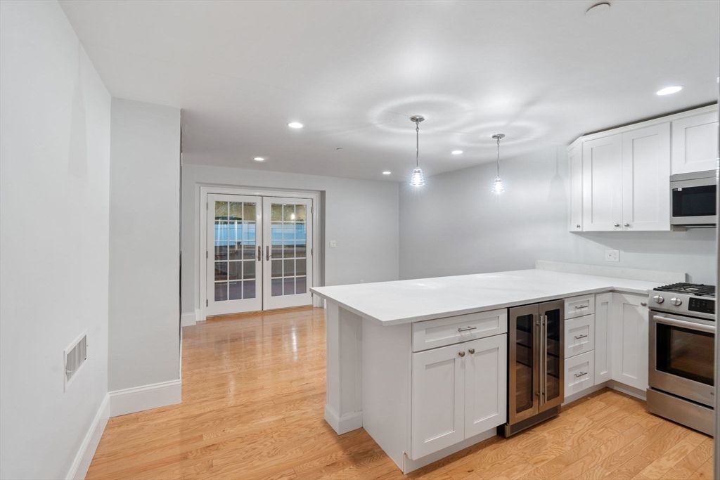 Interior, Kitchen, Pendant Lights, Recessed Lighting, Stainless Steel Appliances, Wood Texture Flooring