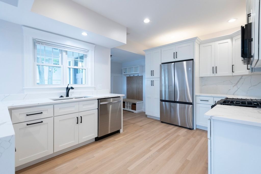 Interior, Kitchen, Marble Walls, Recessed Lighting, Stainless Steel Appliances, Wood Texture Flooring
