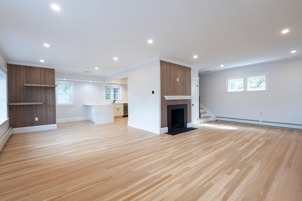 Empty room, Fireplace, Interior, Kitchen, Marble Walls, Recessed Lighting, Wood Texture Flooring