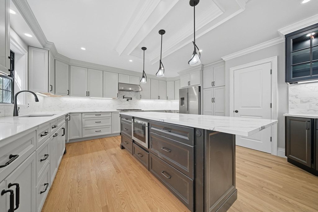 Interior, Kitchen, Marble Walls, Pendant Lights, Recessed Lighting, Stainless Steel Appliances, Wood Texture Flooring