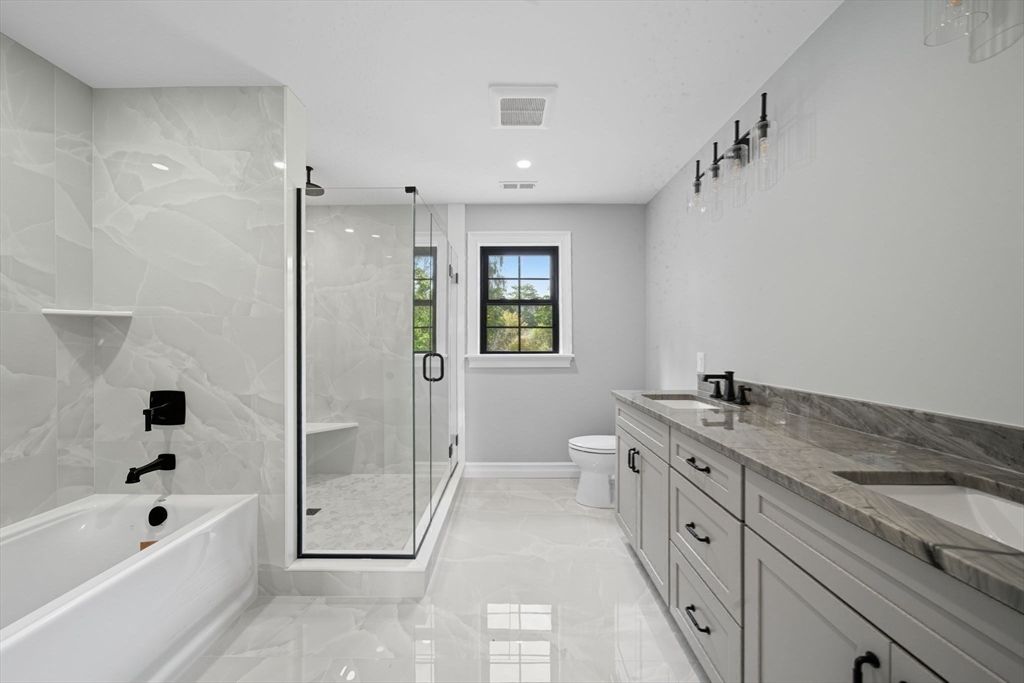 Bathroom, Dual Sink Vanities, Glass Shower, Interior, Marble, Marble Walls, Recessed Lighting