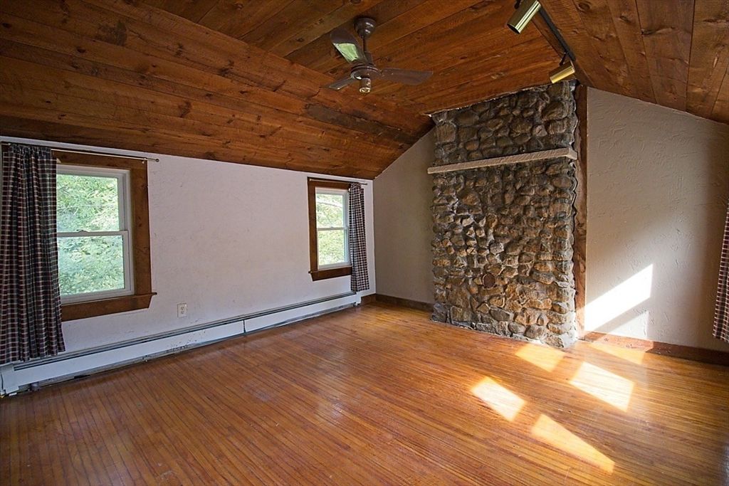 Empty room, Fireplace, Interior, Stone Walls, Wooden Ceilings, Wood Texture Flooring