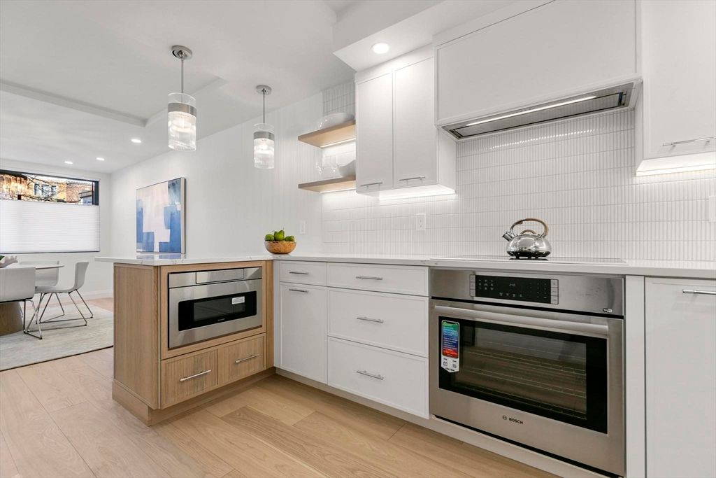 Dining room, Interior, Kitchen, Pendant Lights, Recessed Lighting, Stainless Steel Appliances, Wood Texture Flooring