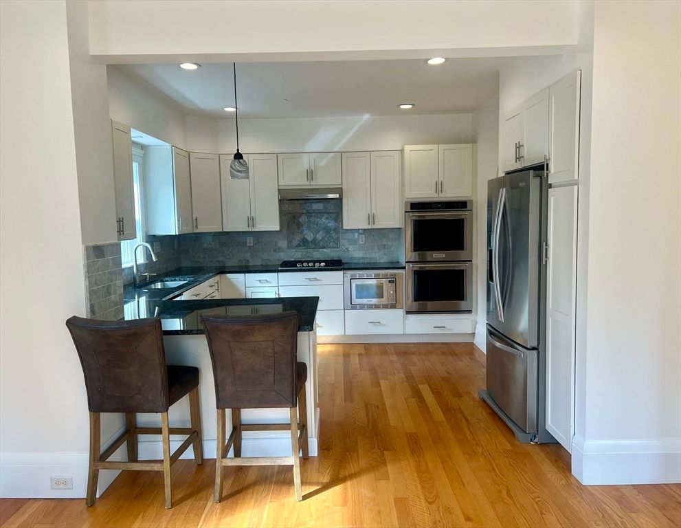 Interior, Kitchen, Pendant Lights, Recessed Lighting, Stainless Steel Appliances, Wood Texture Flooring