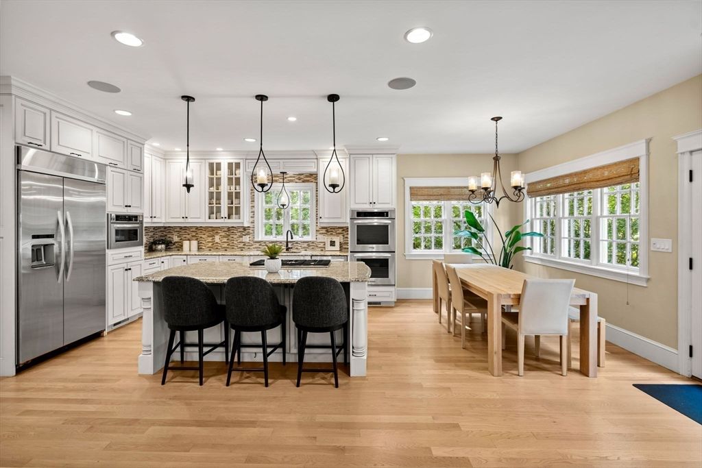 Chandelier, Dining room, Interior, Kitchen, Pendant Lights, Recessed Lighting, Stainless Steel Appliances, Wood Texture Flooring