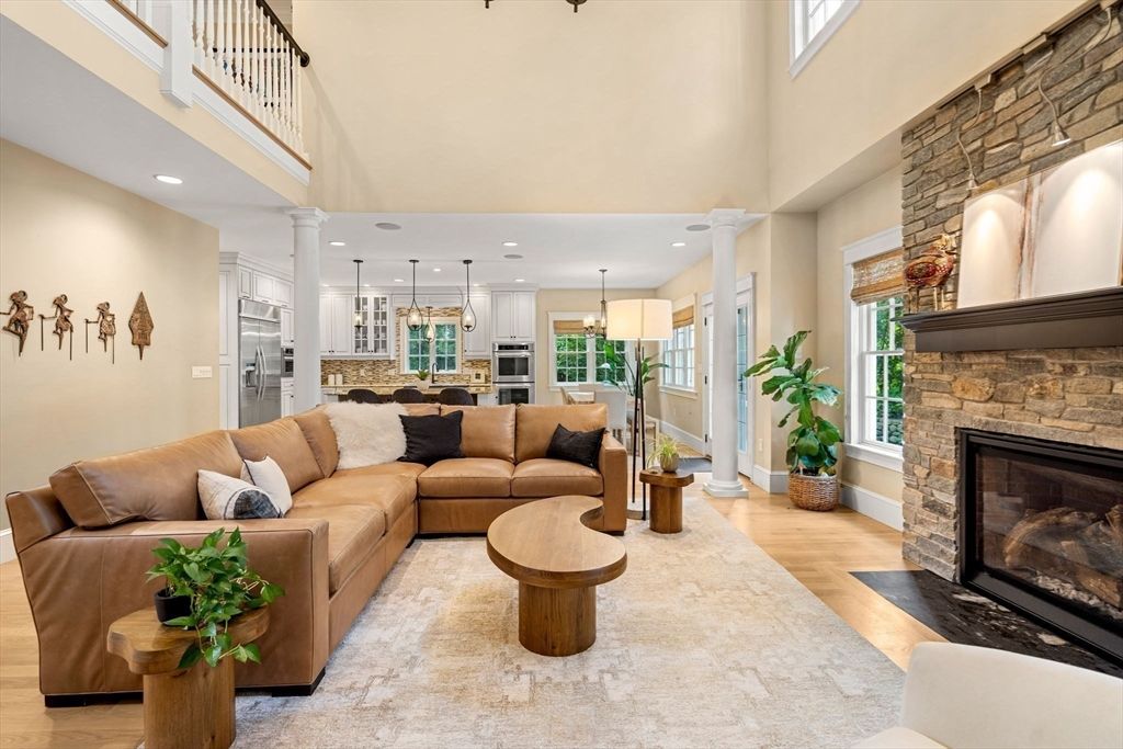 Fireplace, Interior, Kitchen, Living room, Pendant Lights, Recessed Lighting, Stainless Steel Appliances, Stone Walls, Wood Texture Flooring