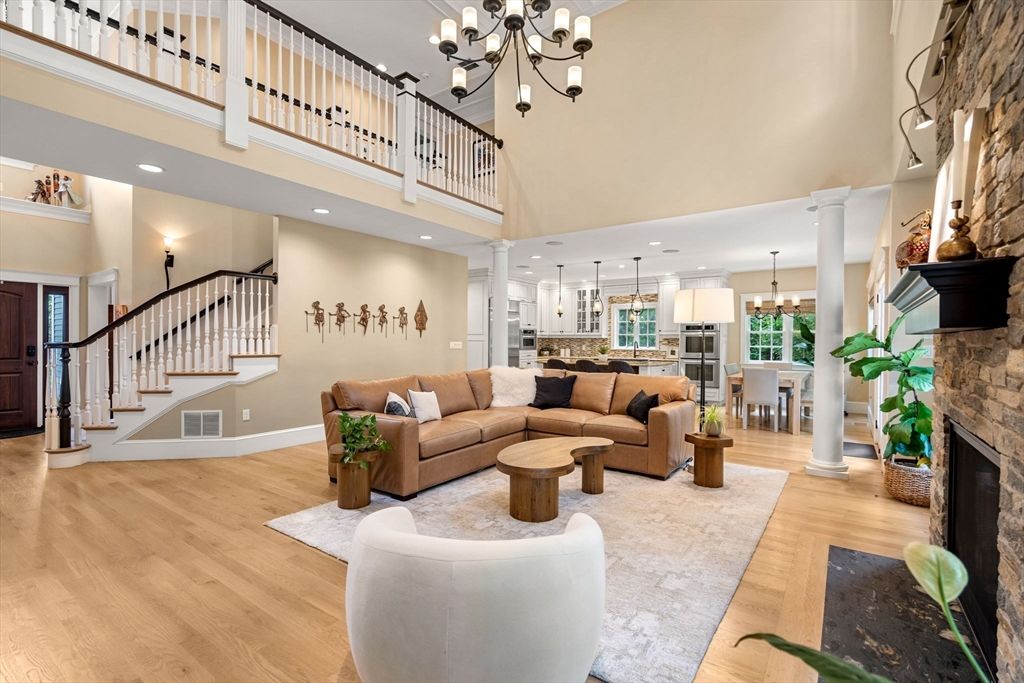 Chandelier, Dining room, Fireplace, Interior, Living room, Pendant Lights, Recessed Lighting, Wood Texture Flooring