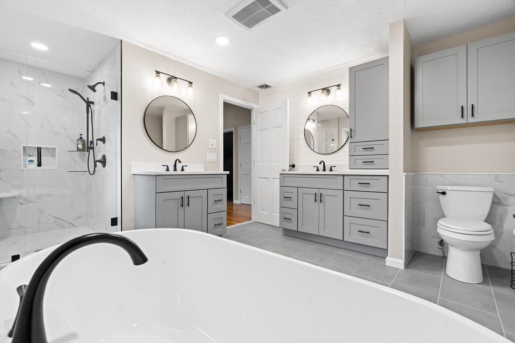 Bathroom, Dual Sink Vanities, Free Standing Baths, Glass Shower, Interior, Marble Walls, Recessed Lighting