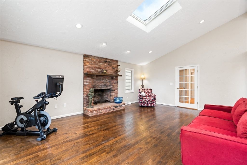 Fireplace, Fitness Equipment, Interior, Recessed Lighting, Stone Walls, Wood Texture Flooring