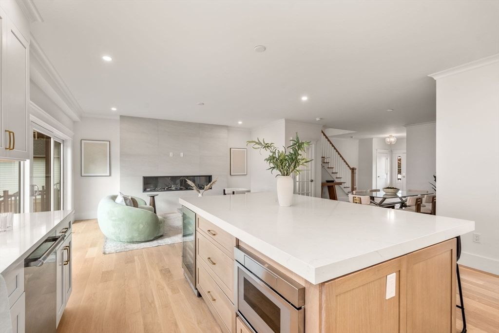 Dining room, Fireplace, Interior, Kitchen, Living room, Recessed Lighting, Stainless Steel Appliances, Wood Texture Flooring