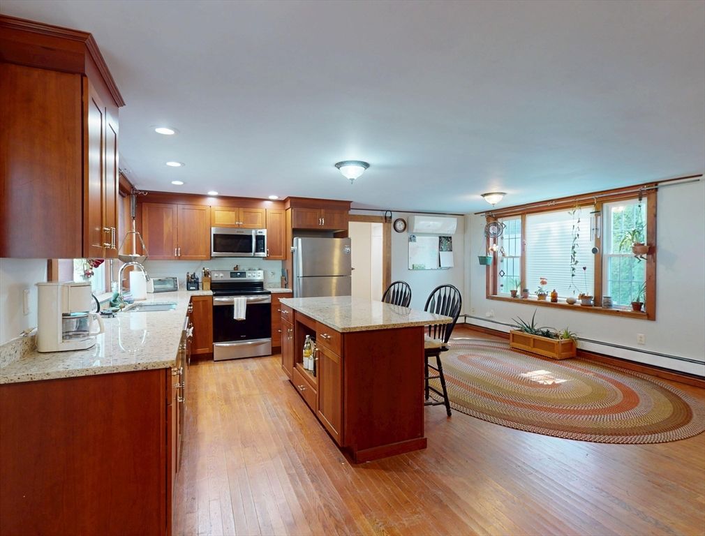 Dining room, Interior, Kitchen, Recessed Lighting, Stainless Steel Appliances, Wood Texture Flooring