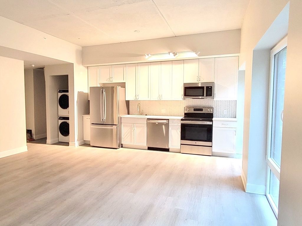 Interior, Kitchen, Recessed Lighting, Stainless Steel Appliances, Washer, Wood Texture Flooring