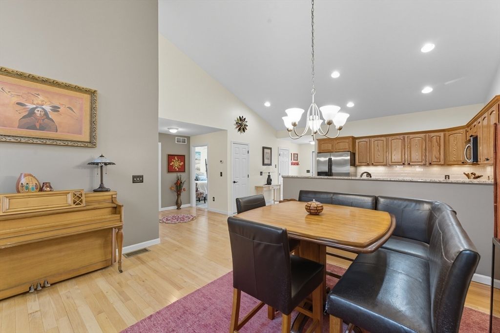 Chandelier, Dining room, Interior, Kitchen, Piano, Recessed Lighting, Stainless Steel Appliances, Wood Texture Flooring
