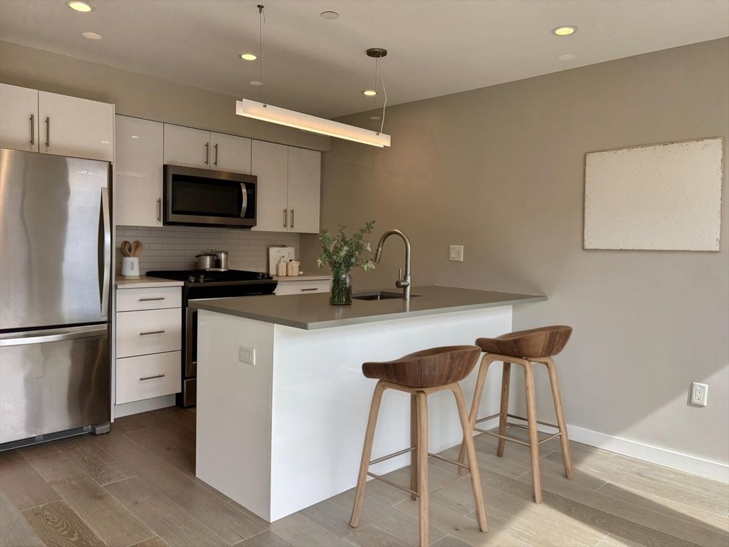 Interior, Kitchen, Pendant Lights, Recessed Lighting, Stainless Steel Appliances, Wood Texture Flooring