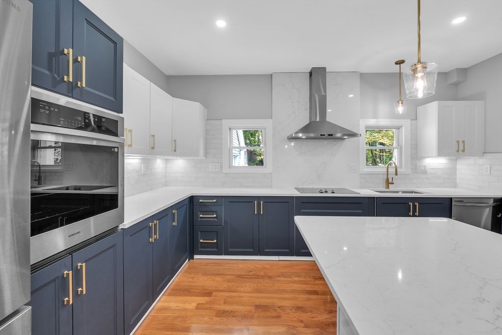 Interior, Kitchen, Marble Walls, Pendant Lights, Recessed Lighting, Stainless Steel Appliances, Wood Texture Flooring