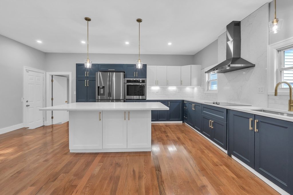 Interior, Kitchen, Marble Walls, Pendant Lights, Recessed Lighting, Stainless Steel Appliances, Wood Texture Flooring