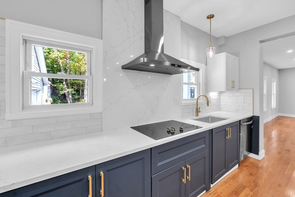 Interior, Kitchen, Marble Walls, Pendant Lights, Recessed Lighting, Stainless Steel Appliances, Wood Texture Flooring