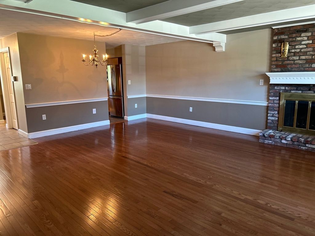 Chandelier, Empty room, Fireplace, Interior, Stone Walls, Wood Texture Flooring