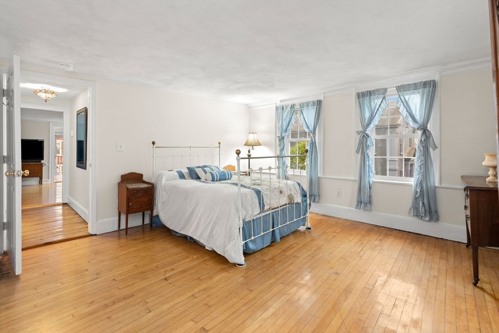 Bedroom, Chandelier, Fireplace, Interior, Wood Texture Flooring