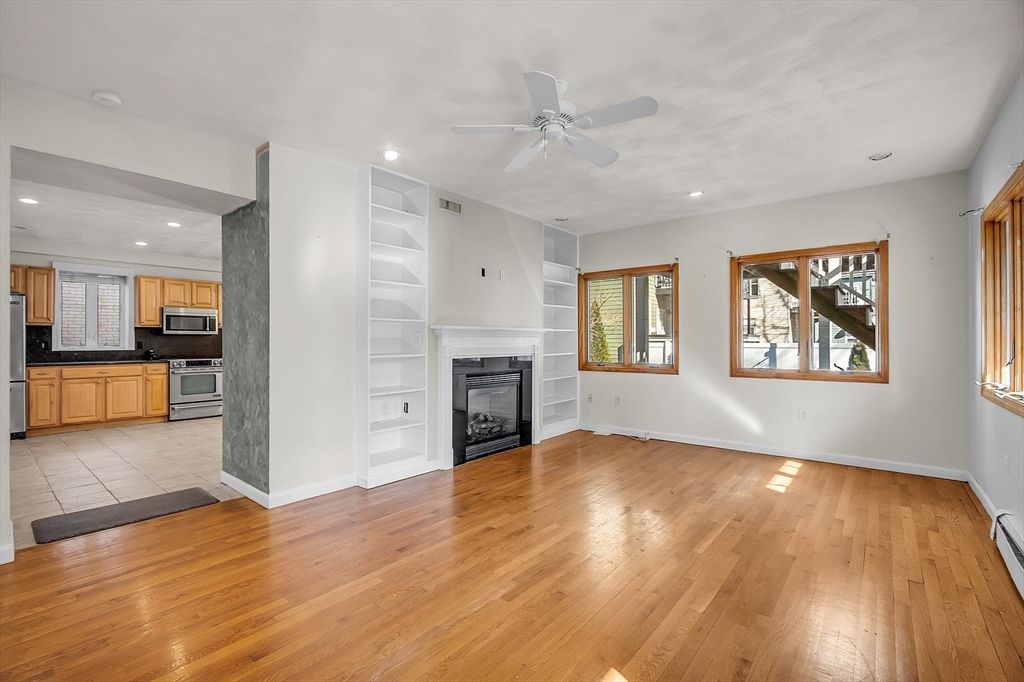 Empty room, Fireplace, Interior, Kitchen, Recessed Lighting, Wood Texture Flooring