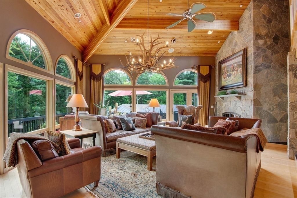 Chandelier, Fireplace, Interior, Living room, Recessed Lighting, Stone Walls, Wooden Beams, Wooden Ceilings, Wood Texture Flooring