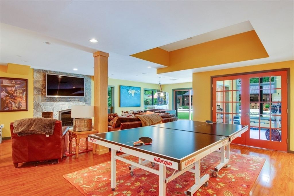 Fireplace, Game Room, Interior, Living room, Pendant Lights, Recessed Lighting, Wood Texture Flooring