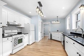 Chandelier, Interior, Kitchen, Pendant Lights, Recessed Lighting, Stainless Steel Appliances, Wood Texture Flooring