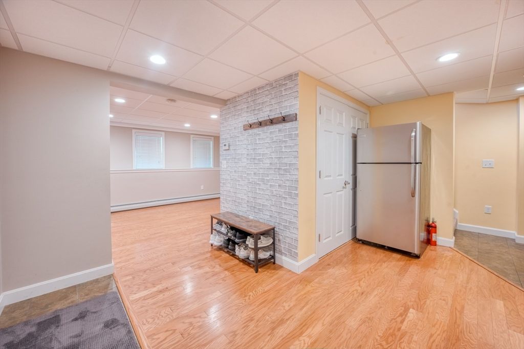 Empty room, Fireplace, Interior, Kitchen, Recessed Lighting, Stone Walls, Wood Texture Flooring