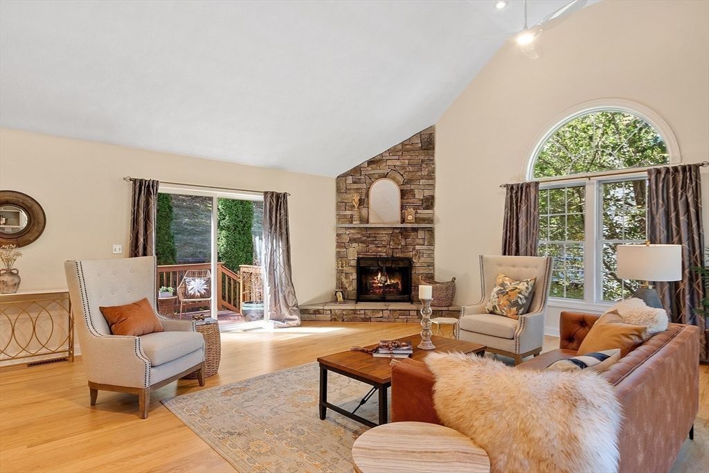 Fireplace, Interior, Living room, Recessed Lighting, Stone Walls, Wood Texture Flooring