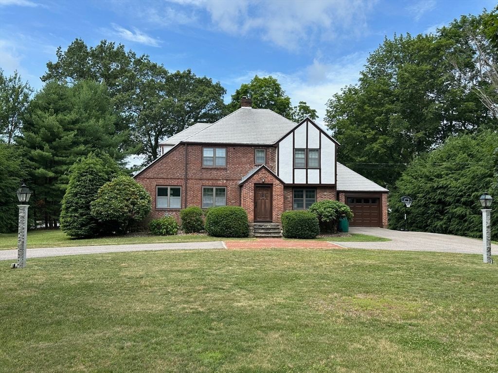 Attached, Backyard, Exterior, Facade, Brick Facade, Tudor Revival