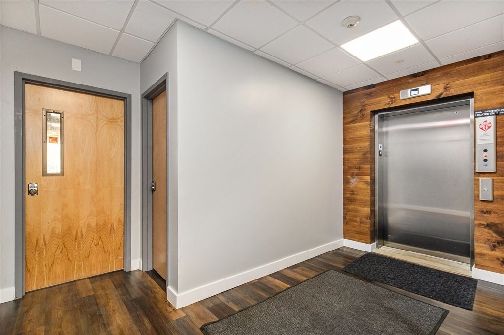 Elevator, Interior, Recessed Lighting, Wood Texture Flooring, Wooden Walls