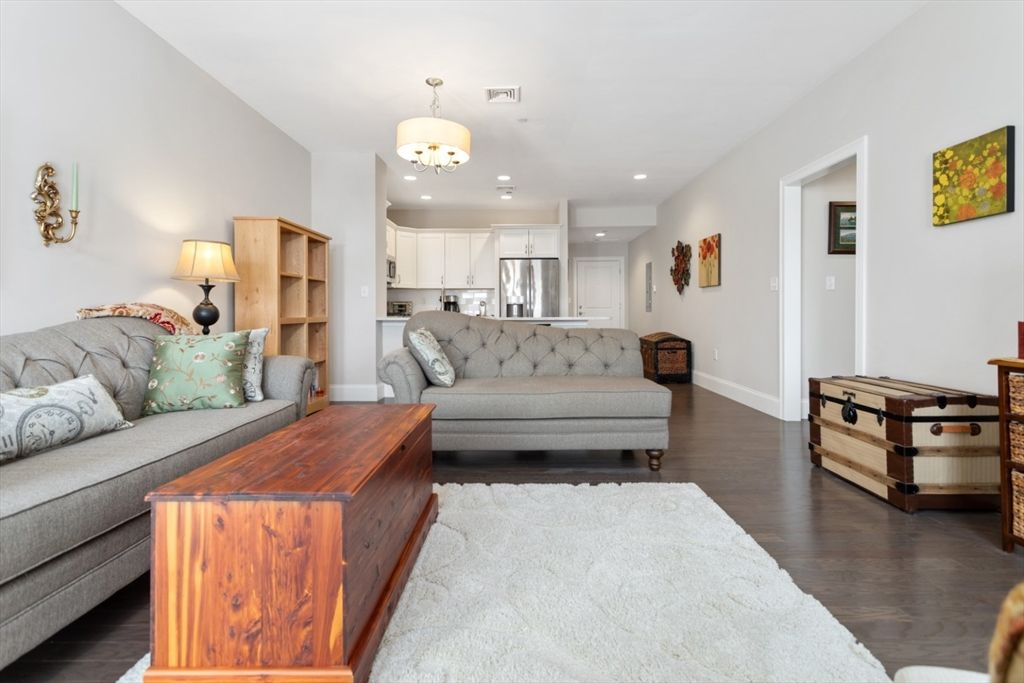 Chandelier, Interior, Kitchen, Living room, Recessed Lighting, Stainless Steel Appliances, Wood Texture Flooring