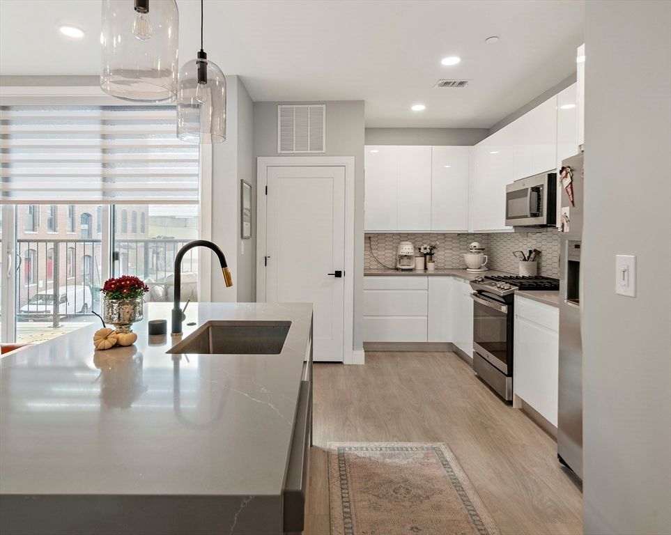 Interior, Kitchen, Pendant Lights, Recessed Lighting, Stainless Steel Appliances, Wood Texture Flooring