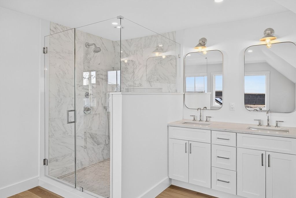 Bathroom, Dual Sink Vanities, Glass Shower, Interior, Marble Walls, Wood Texture Flooring