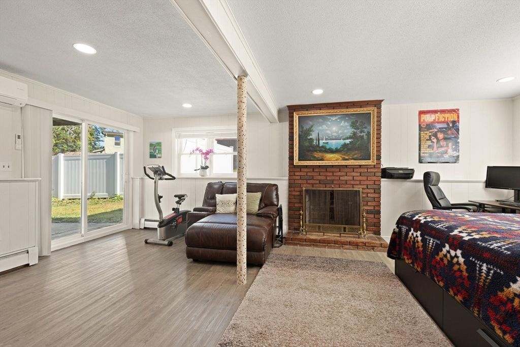 Fireplace, Fitness Equipment, Interior, Recessed Lighting, Wood Texture Flooring