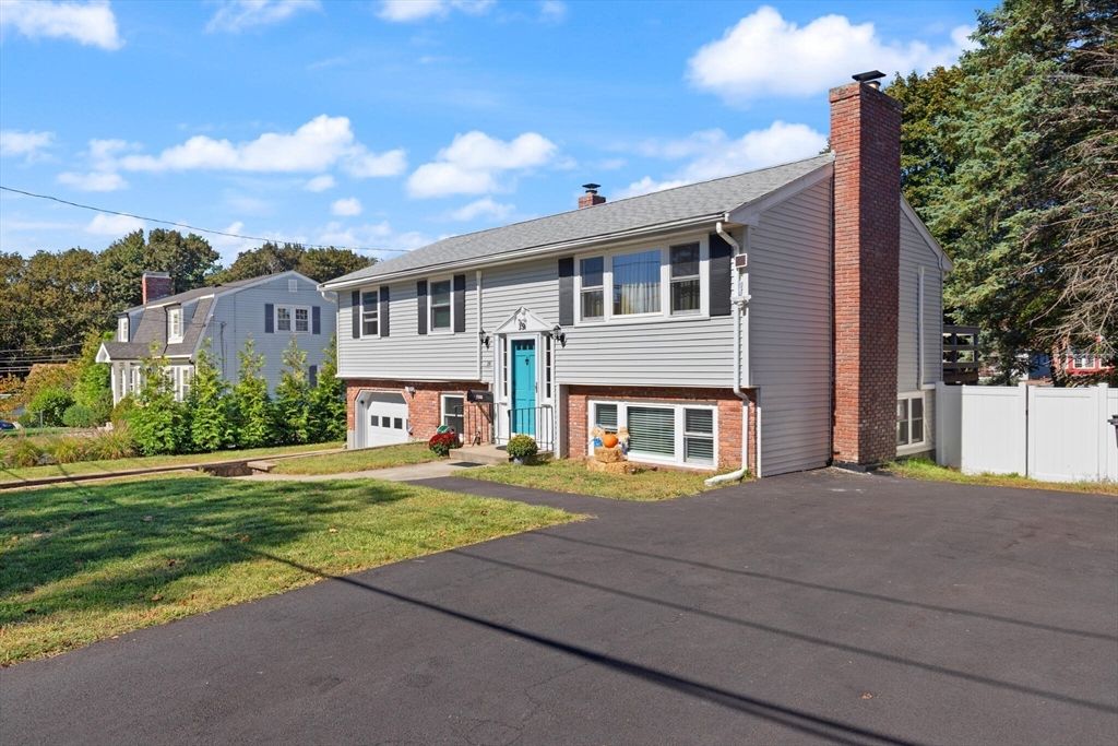 Attached, Backyard, Exterior, Facade, Brick Facade, Raised Ranch