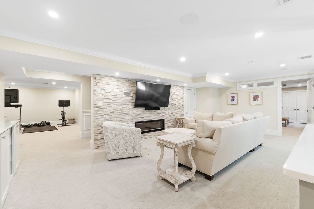 Fireplace, Fitness Equipment, Interior, Living room, Recessed Lighting, Stone Walls