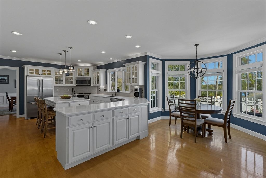 Chandelier, Dining room, Interior, Kitchen, Pendant Lights, Recessed Lighting, Stainless Steel Appliances, Wood Texture Flooring