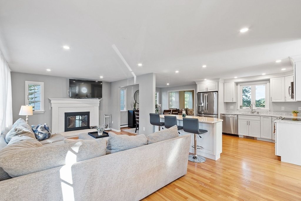 Dining room, Fireplace, Interior, Kitchen, Living room, Recessed Lighting, Stainless Steel Appliances, Wood Texture Flooring