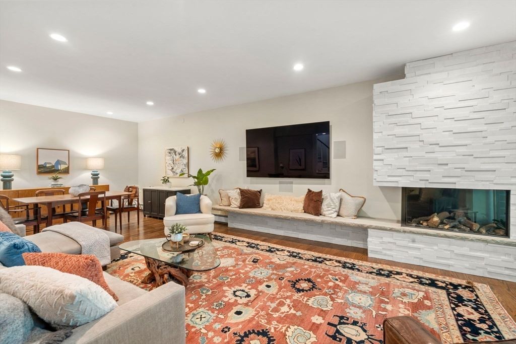 Dining room, Fireplace, Interior, Living room, Recessed Lighting, Stone Walls, Wood Texture Flooring