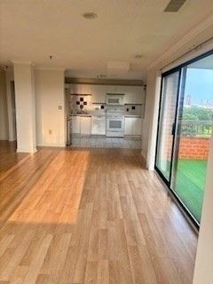 Empty room, Interior, Kitchen, Recessed Lighting, Stainless Steel Appliances, Wood Texture Flooring