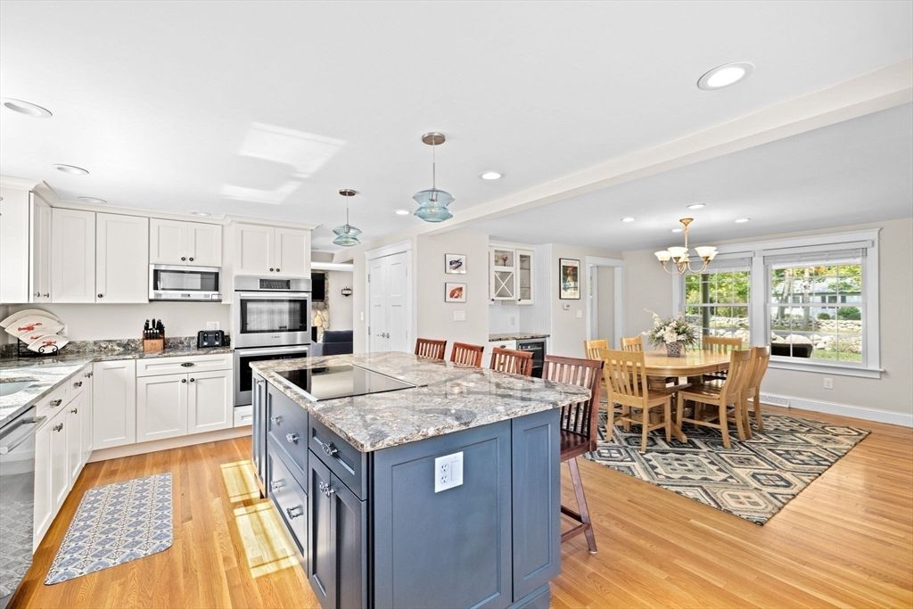 Chandelier, Dining room, Interior, Kitchen, Pendant Lights, Recessed Lighting, Stainless Steel Appliances, Wood Texture Flooring