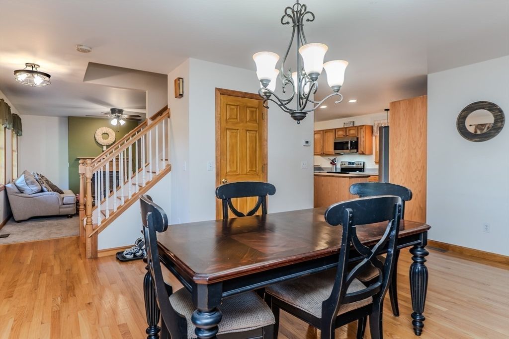 Chandelier, Dining room, Interior, Kitchen, Stainless Steel Appliances, Wood Texture Flooring