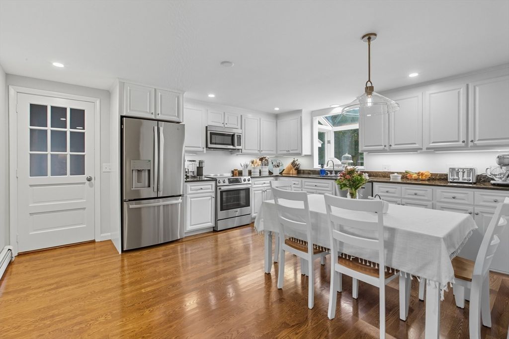 Dining room, Interior, Kitchen, Pendant Lights, Recessed Lighting, Stainless Steel Appliances, Wood Texture Flooring