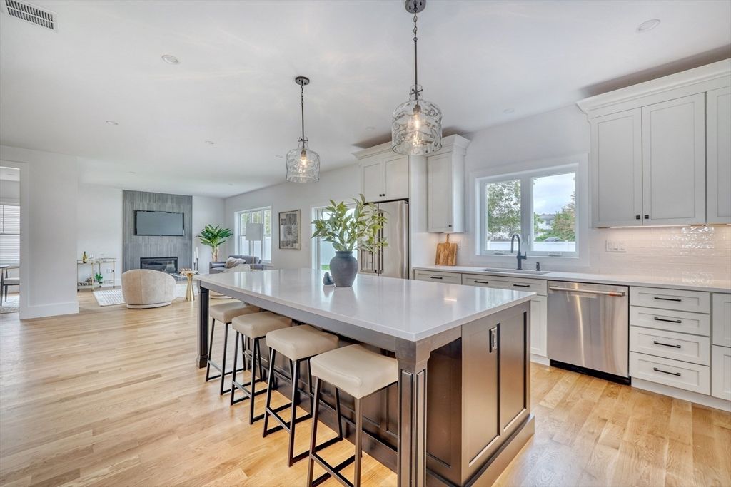Fireplace, Interior, Kitchen, Pendant Lights, Recessed Lighting, Stainless Steel Appliances, Wood Texture Flooring