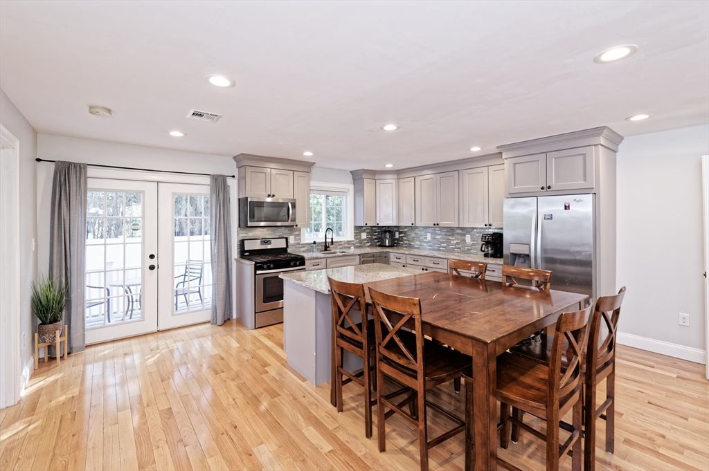 Dining room, Interior, Kitchen, Recessed Lighting, Stainless Steel Appliances, Wood Texture Flooring