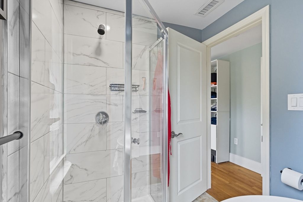 Bathroom, Glass Shower, Interior, Marble Walls, Wood Texture Flooring