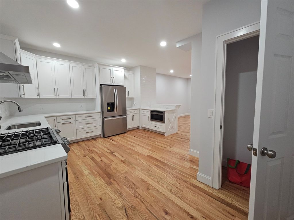 Interior, Kitchen, Recessed Lighting, Stainless Steel Appliances, Wood Texture Flooring