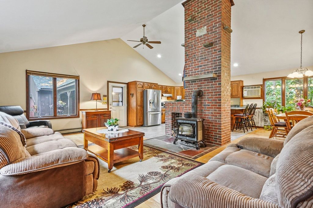 Dining room, Fireplace, Interior, Kitchen, Living room, Pendant Lights, Recessed Lighting, Stainless Steel Appliances, Stone Walls, Wood Texture Flooring