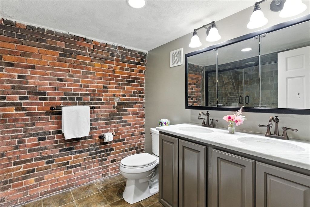 Bathroom, Dual Sink Vanities, Interior, Recessed Lighting, Stone Walls